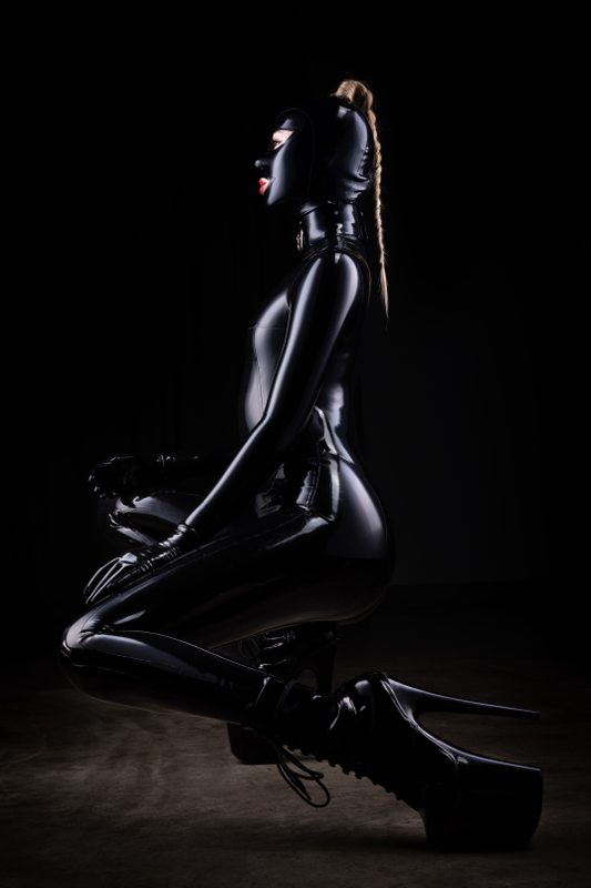 A sexy photograph of Defiantly Yours, in black latex. Posted July 2020.