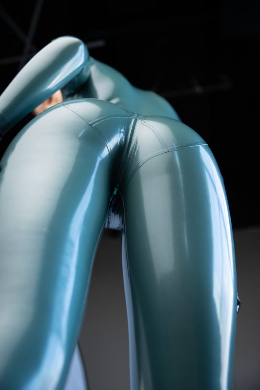A sexy photograph of Mbot, in blue latex. Posted April 2021.