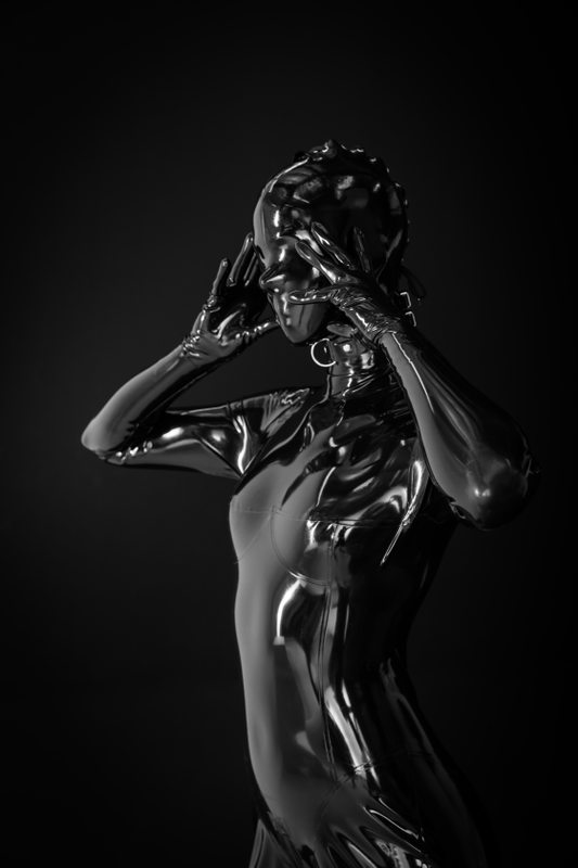 A sexy photograph of Mbot in black latex. Posted December 2018.