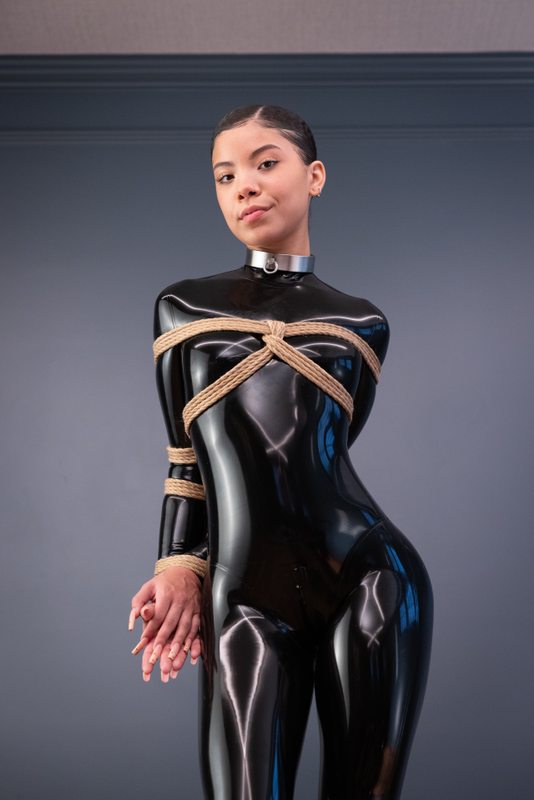 A sexy photograph of Shweetie, in black latex. Tagged with: rope. Posted December 2021.