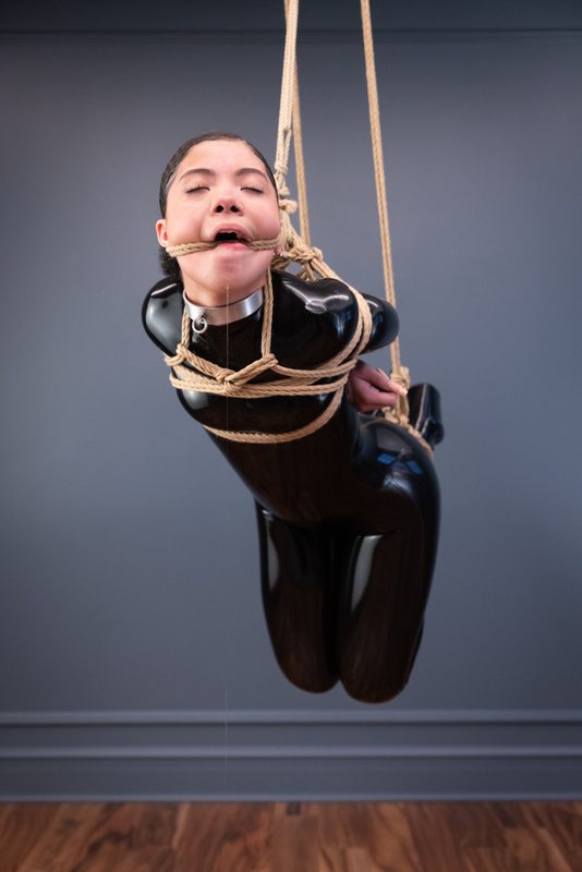 A sexy photograph of Shweetie in black latex. Tagged with: rope & gagged. Posted December 2021.