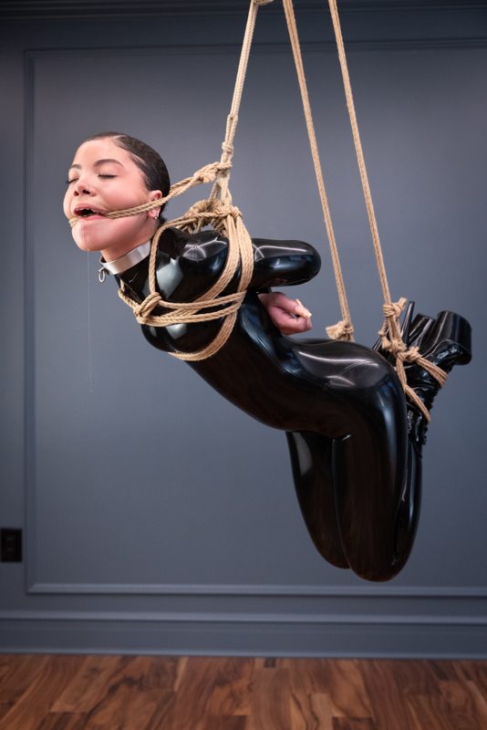 A sexy photograph of Shweetie, in black latex. Tagged with: rope & gagged. Posted December 2021.