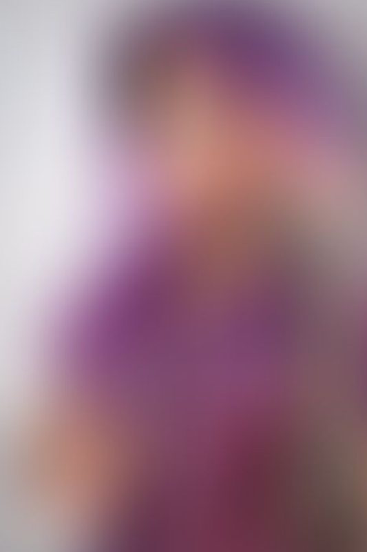 A sexy photograph of Ravyn Alexa in purple & pink &amp; transparent latex. Posted April 2022.