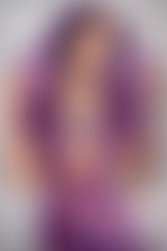 A sexy photograph of Ravyn Alexa in purple & pink &amp; transparent latex. Posted April 2022.