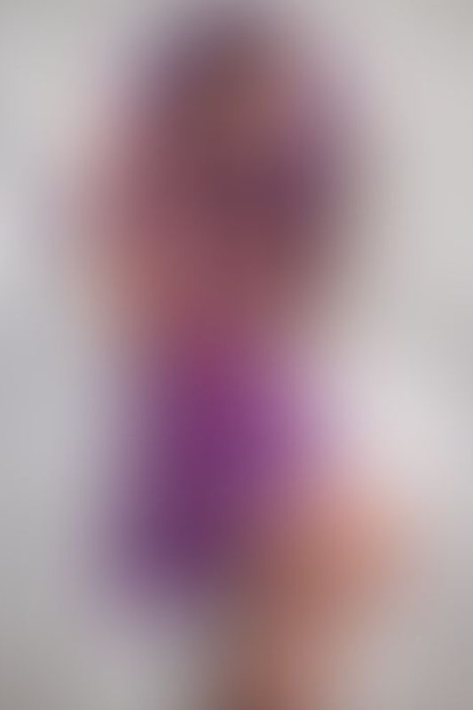 A sexy photograph of Ravyn Alexa in transparent &amp; purple & pink latex. Posted April 2022.