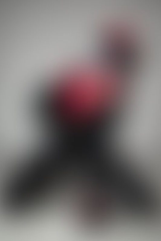 A sexy photograph of Cam Damage in black latex. Posted May 2022.