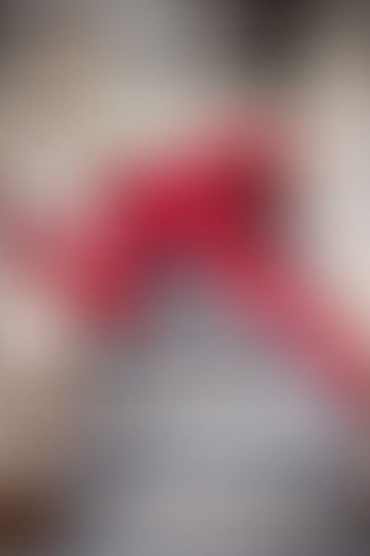 A sexy photograph of Cam Damage in red latex. Posted April 2021.