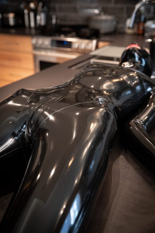 A sexy photograph of Defiantly Yours in black latex. Posted March 2019.
