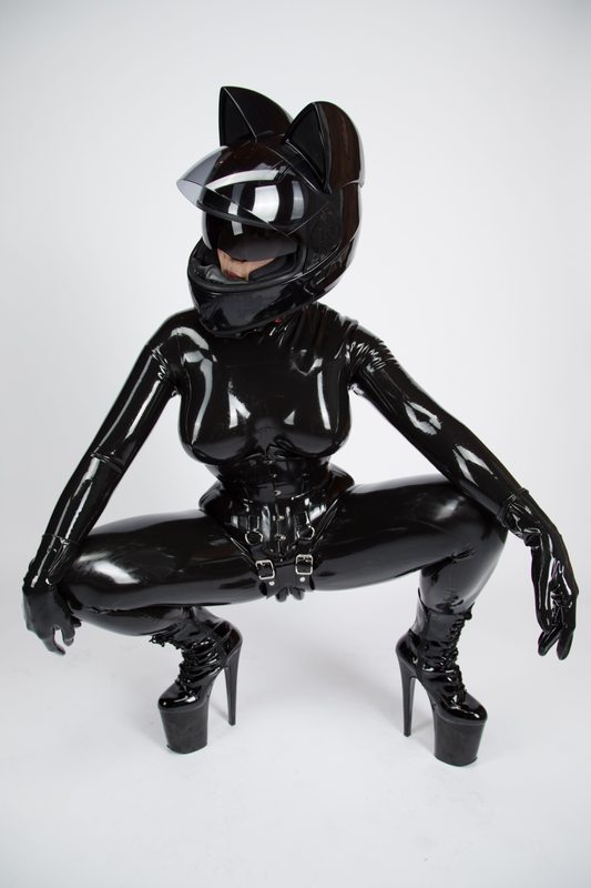 A sexy photograph of Ms Pervology, in black latex. Tagged with: space kitten & moto helmet. Posted November 2017.