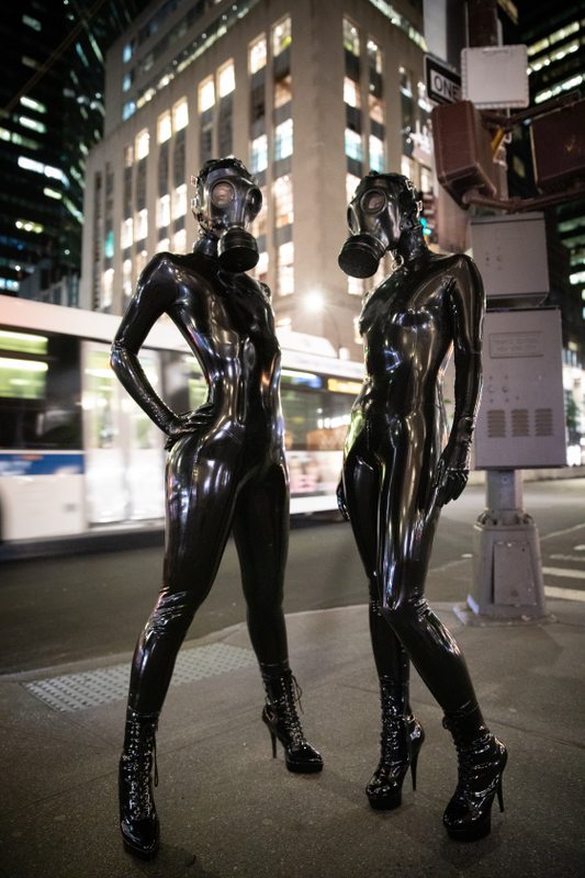 A sexy photograph of Vespa & Cam Damage, in black latex. Tagged with: in public & gasmask. Posted June 2019.