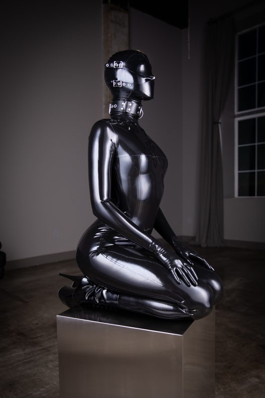 A sexy photograph of Mbot in black latex. Posted March 2020.