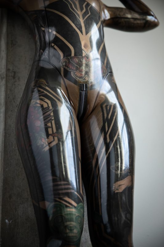 A sexy photograph of Fire Rabbit, in transparent latex. Tagged with: tattoos. Posted February 2020.