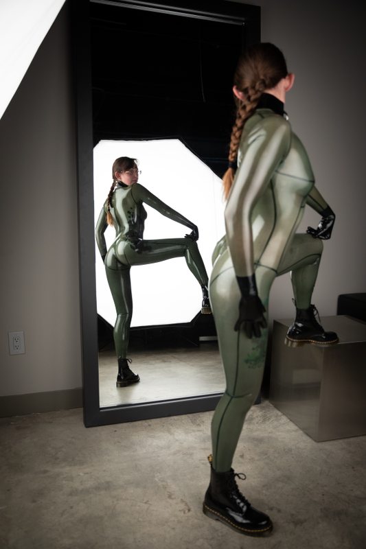 A sexy photograph of Nim Pup in transparent latex. Tagged with: tattoos. Posted February 2020.