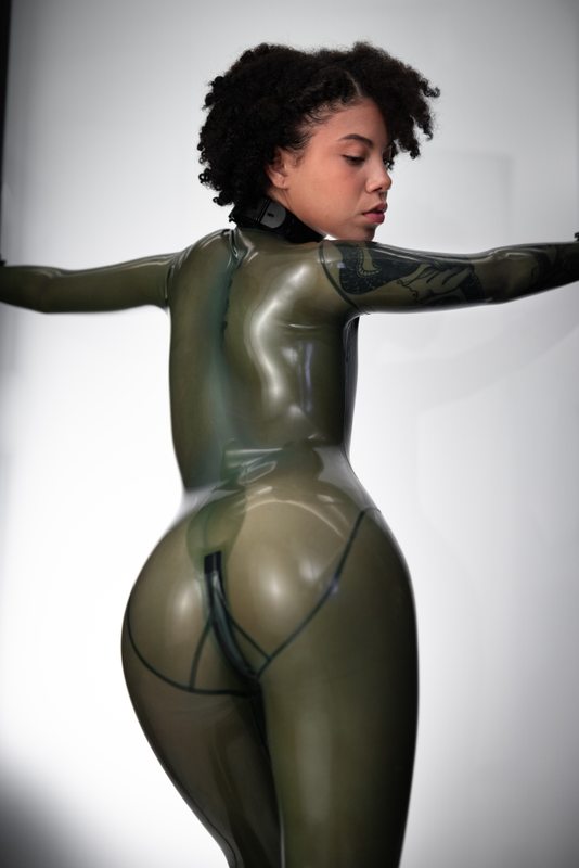 A sexy photograph of Shweetie in transparent latex. Posted May 2022.