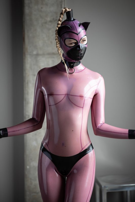 A sexy photograph of Glossy Toy in transparent & purple & pink latex. Tagged with: kitten. Posted April 2020.