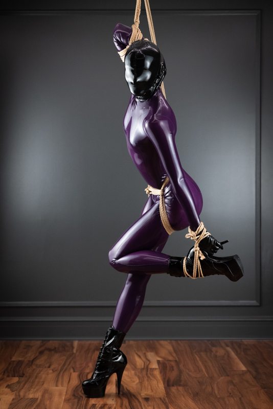 A sexy photograph of Vespa & Tie Rope Take Photo in purple & pink latex. Tagged with: bondage & rope / shibari. Posted February 2023.