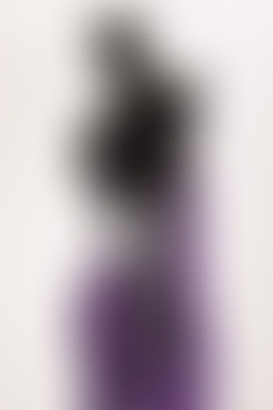 A sexy photograph of Cam Damage in purple & pink latex. Tagged with: gags &amp; armbinder. Posted March 2018.