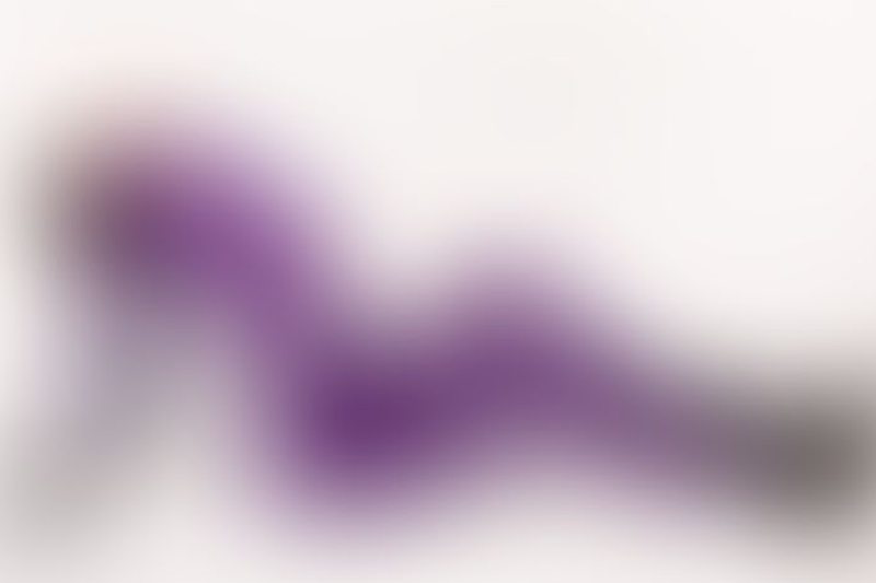 A sexy photograph of Cam Damage in purple & pink latex. Posted March 2018.