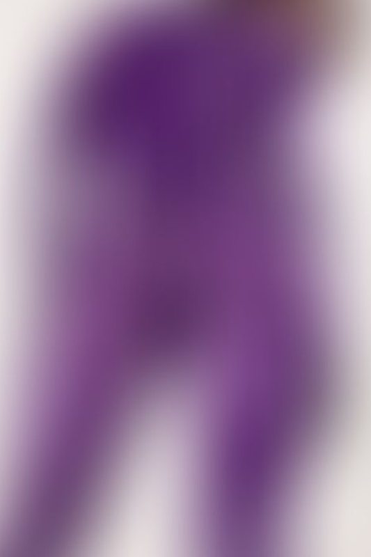 A sexy photograph of Cam Damage in purple & pink latex. Posted March 2018.