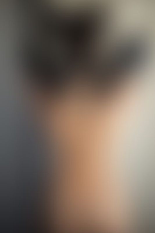 A sexy photograph of Ravyn Alexa showing bare skin with black latex. Tagged with: tattoos. Posted November 2019.