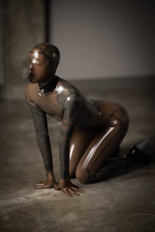 A sexy photograph of Cam Damage in transparent latex. Tagged with: breath play. Posted July 2021.