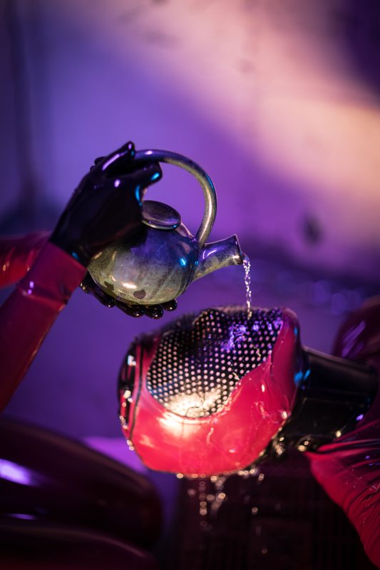 A sexy photograph of Vespa &amp; Rope Candy in red latex. Posted December 2016.