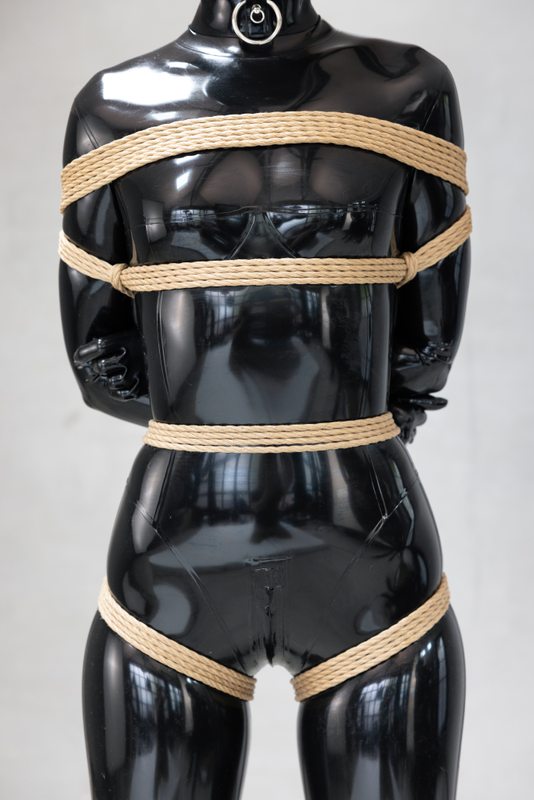 A sexy photograph of Vespa in black latex. Tagged with: rope / shibari.