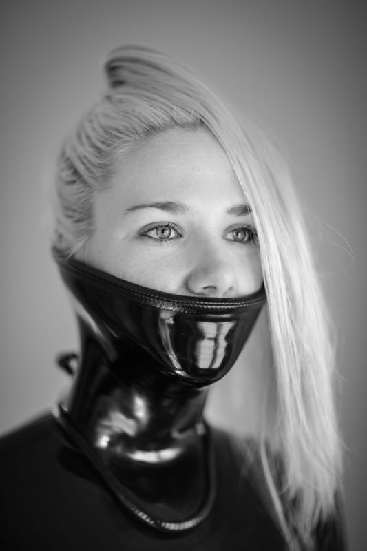 A sexy photograph of Rope Candy in black latex. Tagged with: neck corset. Posted September 2016.