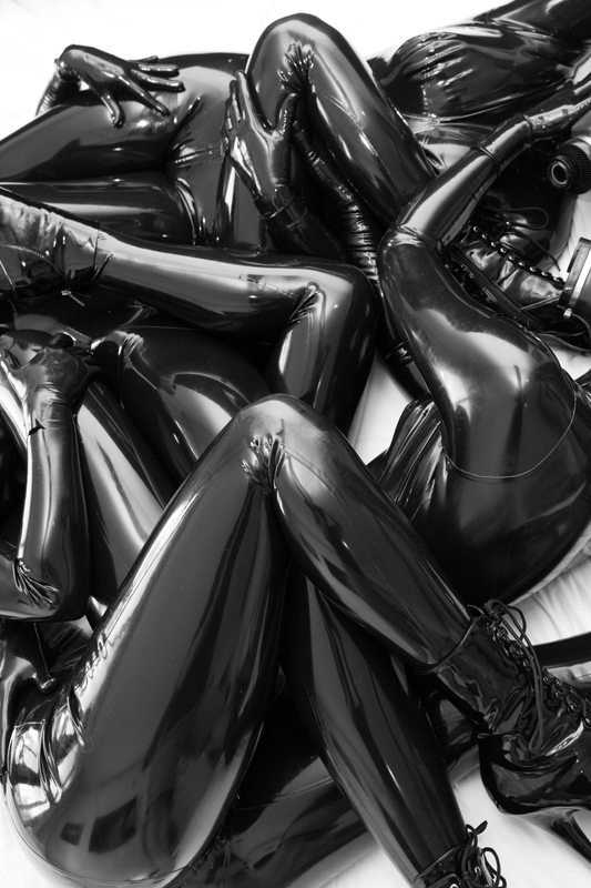 A sexy photograph of Vespa, Opal Snow, Nico & Chell, in black latex. Posted July 2017.