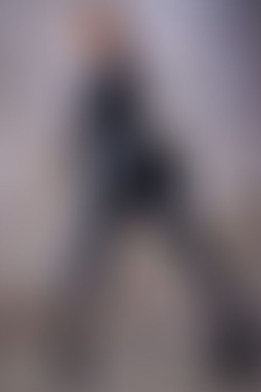 A sexy photograph of Emma Magnolia in black latex. Posted April 2026.