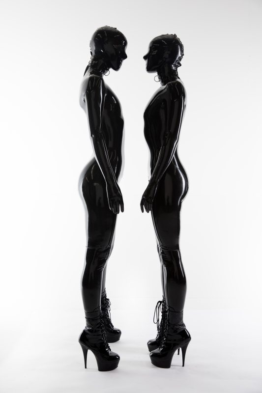 A sexy photograph of Cam Damage & Vespa in black latex. Posted January 2018.
