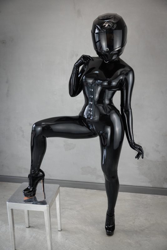 A sexy photograph of Miss Chill in black latex. Tagged with: moto helmet. Posted November 2022.
