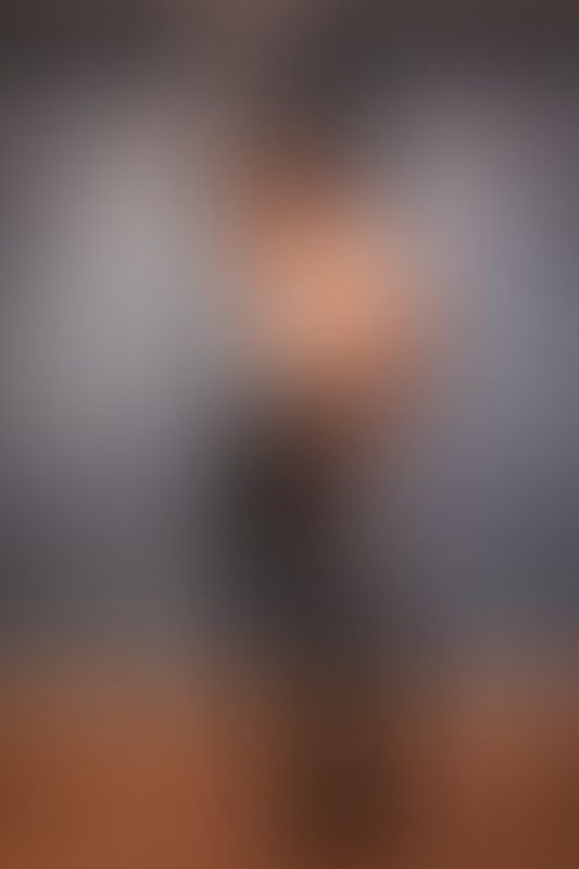 A sexy photograph of Shweetie showing bare skin with black latex. Posted September 2021.
