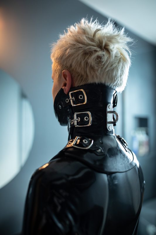 A sexy photograph of black latex. Tagged with: neck corset. Posted June 2016.