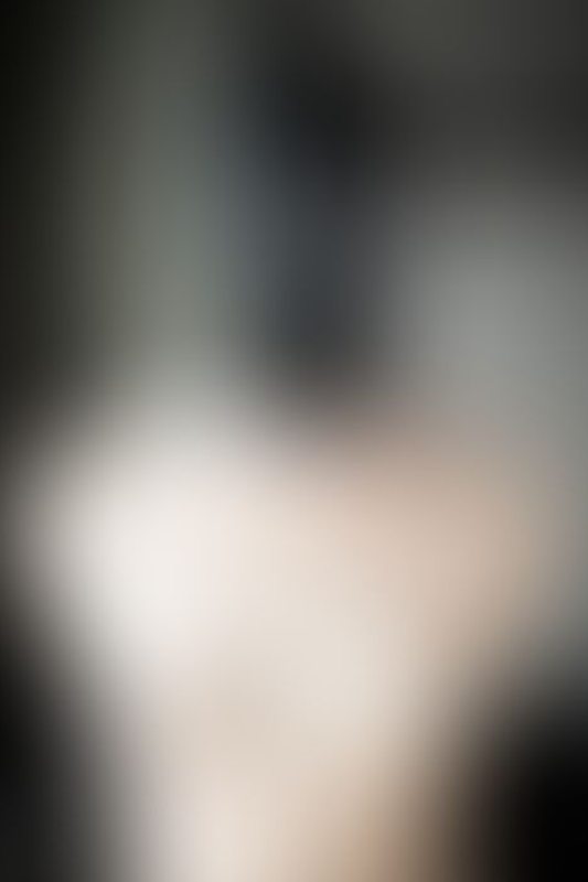 A sexy photograph of Mbot showing bare skin with black latex. Posted September 2019.