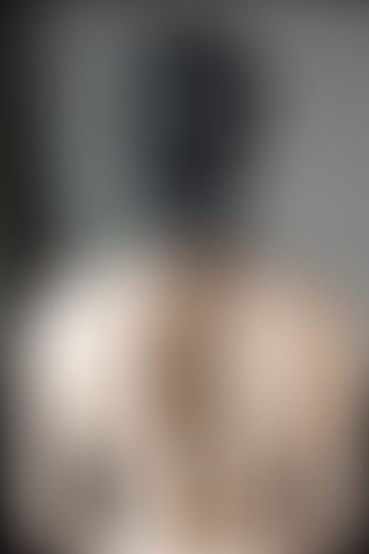 A sexy photograph of Mbot showing bare skin with black latex. Posted September 2019.