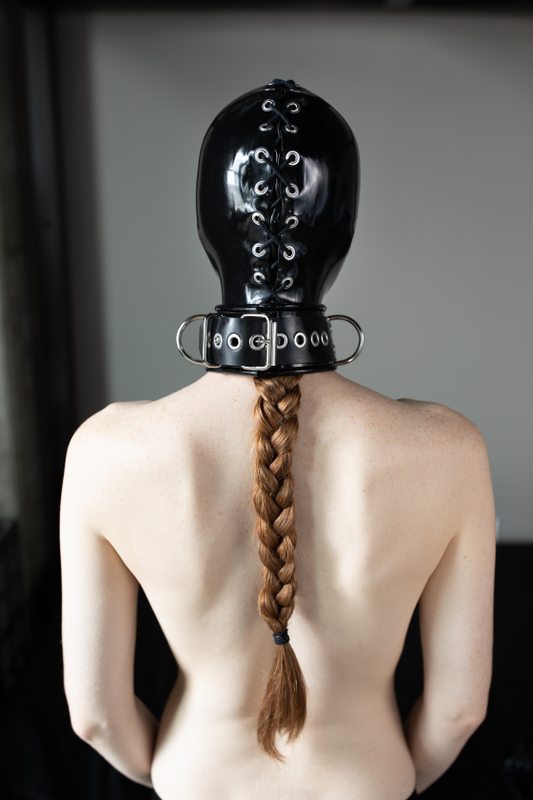A photo album of Mbot, showing bare skin with black latex. Tagged with: armbinder, muzzle & chains. Posted September 2019.
