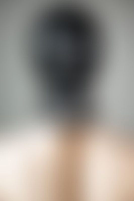 A sexy photograph of Mbot showing bare skin with black latex. Posted September 2019.