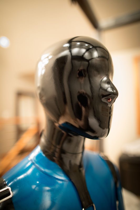 A sexy photograph of Vespa, in transparent & blue latex. Posted December 2016.