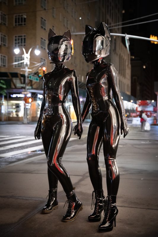 A sexy photograph of Cam Damage & Vespa in black latex. Tagged with: in public, space kitten & moto helmet. Posted April 2020.