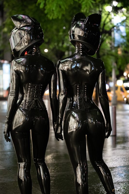 A sexy photograph of Cam Damage & Vespa in black latex. Tagged with: in public, space kitten & moto helmet. Posted April 2020.