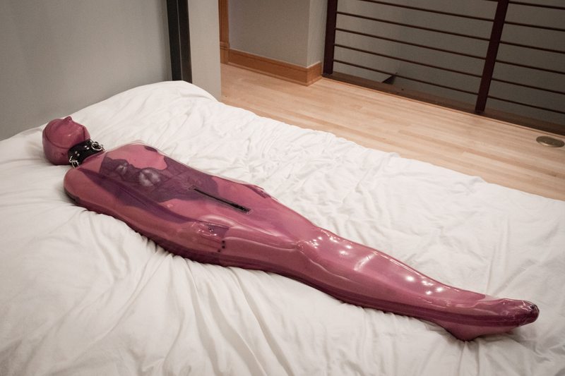 A sexy photograph of Vespa in transparent & purple & pink latex. Tagged with: sleepsack. Posted March 2017.