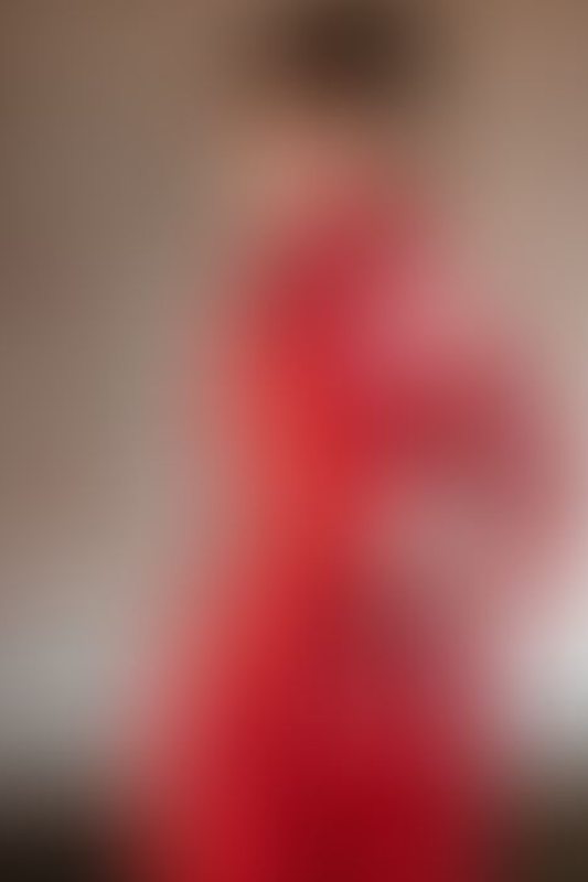 A sexy photograph of Succubunnyy in red latex. Posted August 2025.
