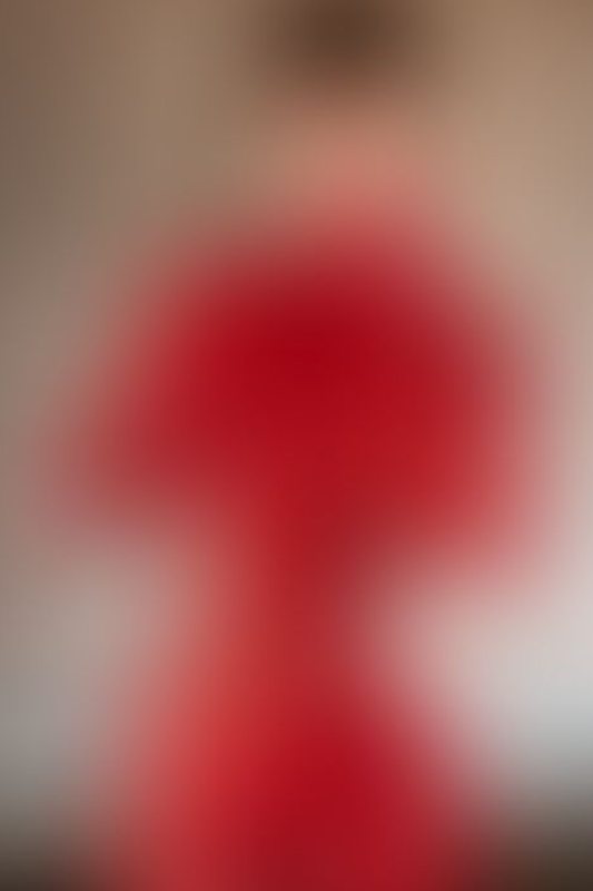A sexy photograph of Succubunnyy in red latex. Posted August 2025.