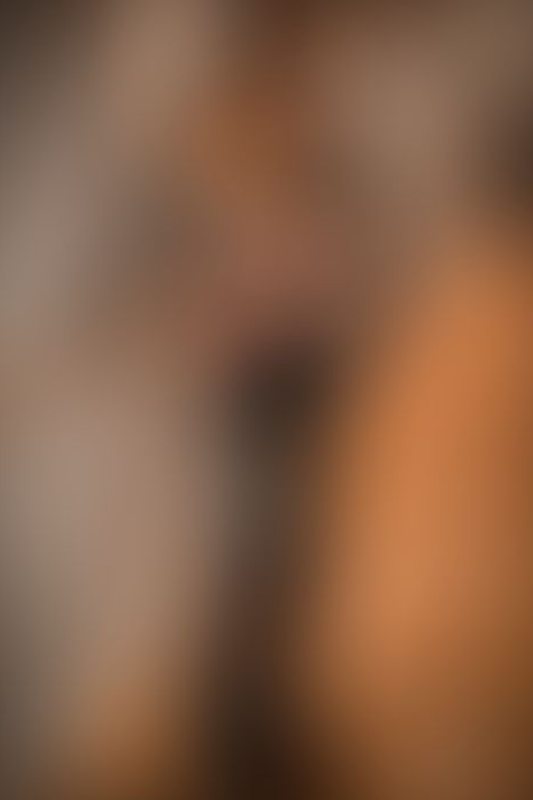 A sexy photograph of Knotasha showing bare skin with black latex. Posted January 2018.