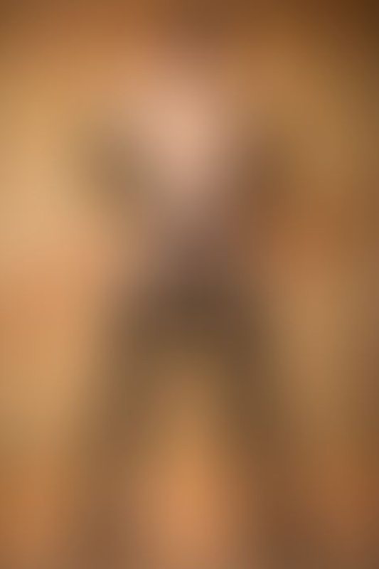 A sexy photograph of Knotasha showing bare skin with black latex. Posted January 2018.
