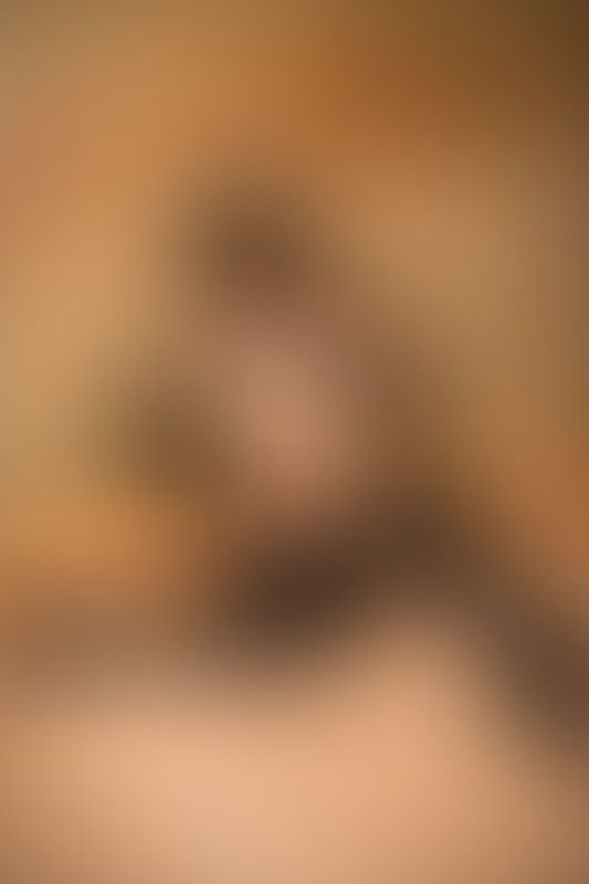 A sexy photograph of Knotasha showing bare skin with black latex. Posted January 2018.