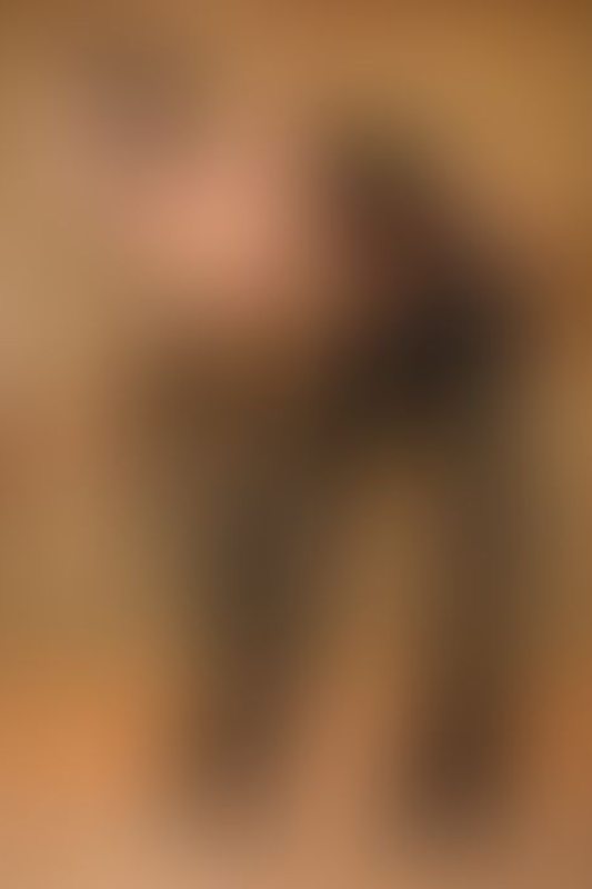 A sexy photograph of Knotasha showing bare skin with black latex. Posted January 2018.