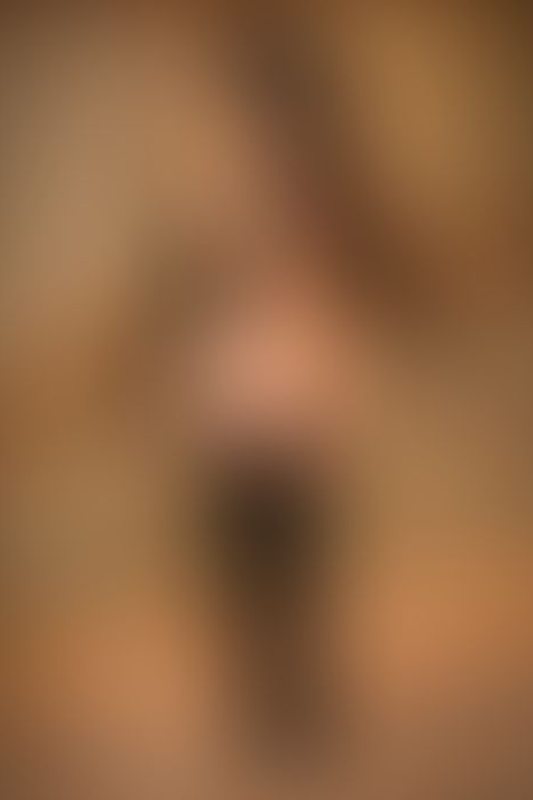 A sexy photograph of Knotasha showing bare skin with black latex. Posted January 2018.