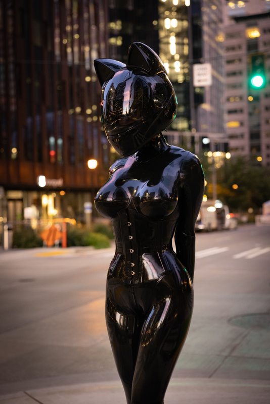 A sexy photograph of Vespa in black latex. Tagged with: space kitten, moto helmet & in public. Posted September 2021.